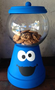 a cookie jar with cookies in it sitting on top of a table