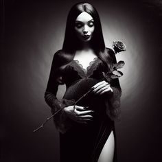 a woman with long hair holding a rose