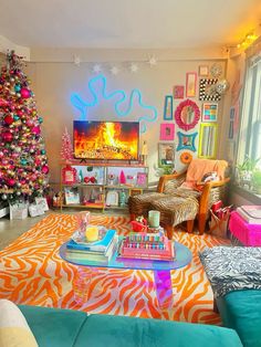 a living room decorated for the holidays with neon lights and christmas tree in the corner