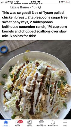 a white plate topped with salad covered in dressing