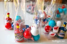 several small plastic bags filled with different types of candies and candys on a table