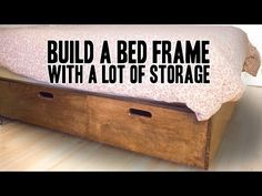 a bed frame with a lot of storage underneath it and the words build a bed frame with a lot of storage underneath it