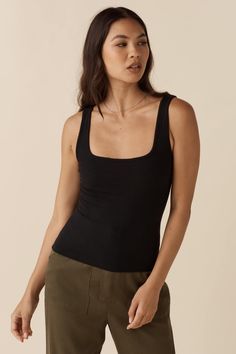 This new fitted tank is vital to your year round capsule wardrobe. Wear it with the square neck or high neck in front, and keep your options open. We love that this simple and versatile top takes you from elegant to lounging in one fell swoop. Insider tip: use code utilitycapsule to purchase all five items in The Utili Year Round Capsule Wardrobe, Sleeveless Tops For Women, 30 Outfits, Open Neck, Sleeveless Tops, The Square, Black Xs, Blazer Dress, Tops For Women