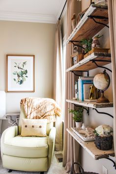 a living room filled with furniture and bookshelves