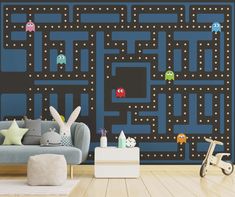 an image of a living room setting with pacman wallpaper