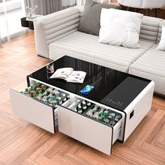 a coffee table with an open drawer underneath it on top of a hard wood floor