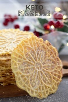 a pile of crackers sitting on top of a wooden cutting board