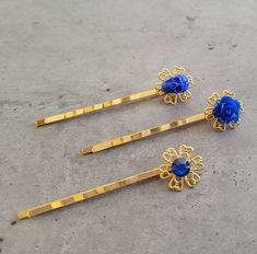 3 pcs Hair Bobby Pins set - Gothic Punk Rock Romantic Steampunk in Gold and Blue 3 pcs of hair pins in Gold and Blue - Skull/flowers. Each of my items is one of a kind and unique.  All the items are made according to what I find special and pretty, but you are more than welcome to ask for any changes that come on your mind. I promise I'll do my best to make it happen.  You will not find another person anywhere in the world wearing the exact same item as yours.  I use the best materials for this kind of fashion, and enjoy creating each item very much. Hope you like my items as I do :)  I do my best to keep my prices low, and you can buy as many items as you like on the same low shipping cost. I ship registered mail worldwide in order to secure your purchase and it usually takes about 3 week Hair Bobby Pins, Skull Flowers, Blue Skull, Blue Skulls, Bear Necklace, Gold And Blue, Steampunk Clothing, Flower Skull, Gothic Punk