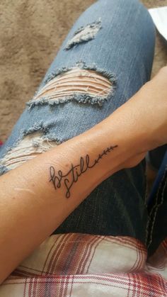 a person with a tattoo on their arm that reads, bestie and has the word'bestie'written in cursive