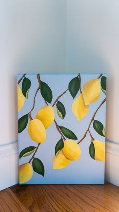 a painting of lemons on a branch with leaves