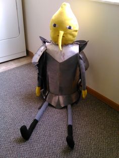 a paper mache character sitting on the floor