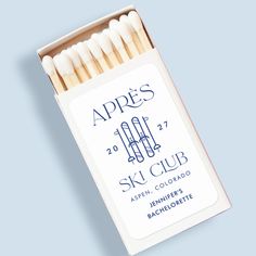 an unopened box of matches with the words apples on it and two white matches