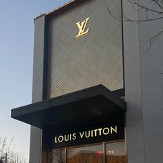 a louis vuitton store front with the logo on it's side window