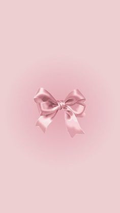 a pink background with a large bow on the top and bottom part of the image