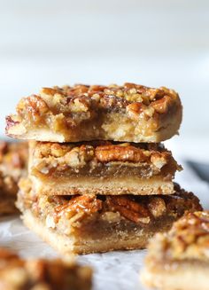 three pieces of pecan bar stacked on top of each other