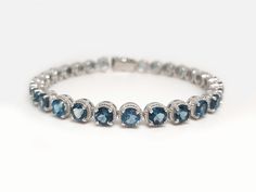 Genuine London Blue Topaz Tennis Bracelet in 925 Sterling Silver Gemstone : Genuine London Blue Topaz Metal used: 925 Sterling Silver Gemstone Shape : Round Width 5mm Gemstone Size     : 5 mm Weight : 16.25 Grams (For 7 Inches) ⦿ Payment Policy :- We accept payment through PayPal. ⦿ Shipping Policy :- * All Items will Be Carefully packed and Shipped Through UPS, Aramex, DHL eCommerce, India Post International, within 1- 2 Business Days from us. * 𝐀𝐥𝐥 𝐃𝐞𝐥𝐢𝐯𝐞𝐫𝐢𝐞𝐬 𝐰𝐢𝐥𝐥 𝐡𝐚𝐯𝐞 𝐎? Elegant White Gold Bracelet With Blue Topaz, Blue Topaz Gemstone Bracelets For Wedding, Wedding Bracelets With Blue Topaz Gemstones, Fine Jewelry Blue Topaz Round Bracelets, Fine Jewelry Blue Topaz Bracelets, Formal Blue Topaz Bracelet, Fine Jewelry Silver Bracelet With Blue Topaz, Silver Blue Topaz Bracelet Fine Jewelry, Silver Blue Topaz Bracelets Fine Jewelry