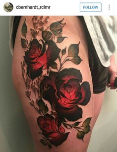 a woman's thigh with roses on it