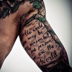 a man's arm with an old book tattoo on it that says the world is not