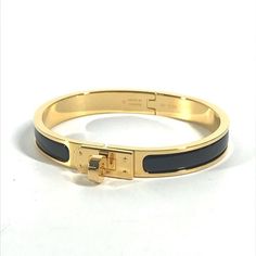 Name: Hermes Accessories Enamel Bracelet "Mini-Click-Kelly" Bangle Bracelet Shape: Bracelet Color: We Ask For Your Understanding In Regards To The Color And Material Of Each Item An Estimation By Our Staff.Goldxblack Material: Metal Approx Size: Band Length: 6.3inch / 16cm Band Width: 3.1inch / 8mm Listed Hand Measurements May Have A 1-2cm Difference. Gender: Women's Additional Items: Box , Dust Bag , Item Rank: Unused Ns Rank (Although Unused This Item May Have Minor Defects Due To Long Term St Kelly Bracelet, Hermes Jewelry, Hermes Accessories, Bracelet Metal, Enamel Bracelet, Fine Jewelry Bracelets, Metal Bracelets, Accessories Bracelets, Bangle Bracelet