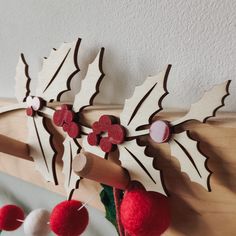 some red and white decorations are hanging on the wall