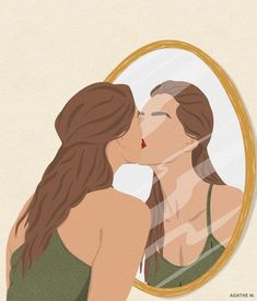 two women kissing in front of a mirror with the reflection of each woman's face