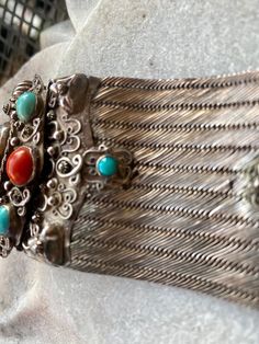 Old Chinese Red Coral Turquoise Lapis Woven Sterling Silver Antique Bracelet Measures aprox 8 Inches in length Good, antique condition, with a small amount of wear due to age. Small worn areas near stone settings not noticeable when worn. Measures aprox 8 inches long and 2 1/2 inches at the widest point. Check out are Art & Antiquities Gallery on our sister Etsy site Vinmana https://www.etsy.com/shop/vinmana Traditional Engraved Turquoise Bracelets, Traditional Turquoise Engraved Bracelet, Vintage Turquoise Sterling Silver Bracelet Collectible, Antique Turquoise Cuff Bracelet For Gift, Traditional Turquoise Sterling Silver Cuff Bracelet, Artisan Hand-strung Red Coral Jewelry, Vintage Turquoise Hand-tooled Bracelets, Usa Jewelry, Antique Bracelets