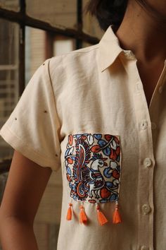 "Linen top for women, Cream linen top, women shirt, made to order, custom made, plus sizepaint Hand painted and embroidered linen top. This shirt is perfect for the summer! -Model height: 5'3\" wearing size S -Kalamkari painting and embroidery on pocket -Top length: 21\" -Short sleeves -Hand painted -Hand embroidered -Pocket embroidery and tassles -Closure: Front shell buttons"