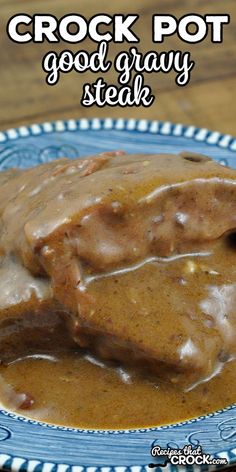 crock pot good gravy steak on a blue and white plate with brown gravy