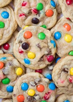 a pile of cookies with m and m candies on top, all in the same color