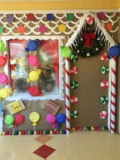 a decorated front door with candy canes and decorations