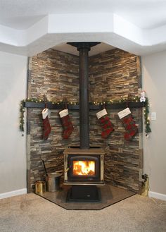 a fireplace with stockings hanging from the mantle