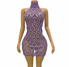 a mannequin with purple sequins on it's torso and neck