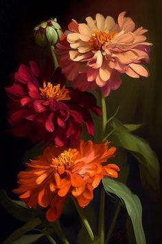 three different colored flowers in a vase