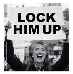 a woman holding up a sign with the words lock him up in front of her