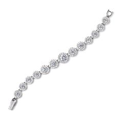 CZ Wedding Bracelet b4542 This glistening bridal bracelet features a rhodium silver plated design with graduating sizes of sparkling CZ crystals. Designed for smaller wrists, this bracelet will be add lots of bling to your wedding ensemble, Size: Decorated portion is 6" long and 0.5" wide at widest point. Color: Silver/Clear. Style: b4542. Please allow 1 week for delivery. Shipping Policy . Return Policy. Formal Cubic Zirconia Tennis Bracelet With Handset Stones, Wedding Crystal Tennis Bracelet With Brilliant Cut, Adjustable Cubic Zirconia Sterling Silver Wedding Bracelet, Sterling Silver Bracelet With Cubic Zirconia For Wedding, Sterling Silver Bracelet With Diamond Accents For Wedding, Wedding Bracelets With Handset Stones, Wedding Cubic Zirconia Diamond Bracelet With Handset Stones, Wedding Diamond Bracelet With Handset Cubic Zirconia Stones, Brilliant Cut Crystal Bracelet For Wedding