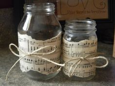 two glass jars with musical notes on them