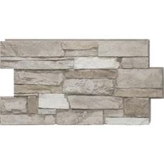 a stone wall that has been made out of different types of stones and is white