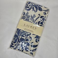 the blue and white floral print is on top of the sheet that has been folded