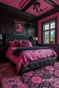 a pink and black bedroom with a large bed in the center, chandelier hanging from the ceiling