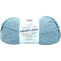 a ball of yarn with the words heartland written on it in white and blue