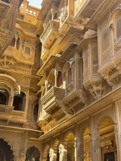 an intricately carved building with balconies and windows