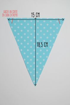 a blue and white polka dot triangle with measurements