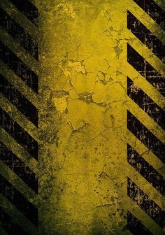 a grungy yellow and black background with diagonal stripes