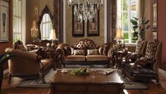 a living room filled with lots of furniture in it's centerpiece and chandelier