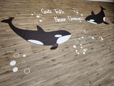 two black and white orca whales on wood flooring with words that say, goats turn never changes