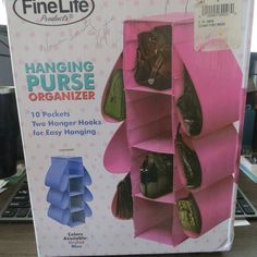 a pink hanging purse organizer with two hangers