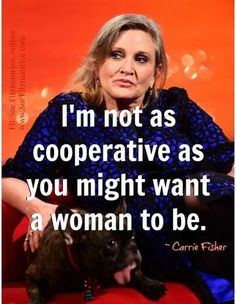 a woman sitting on top of a red couch next to a black dog with a caption that reads, i'm not as cooperative as you might want to be a woman to be