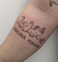 a tattoo with the words hakuna mataha and an animal on it