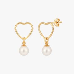 Introducing a precious gift from the ocean: the luminous white crystal pearl earring attached to a heart-shaped post. This exquisite handmade piece is an ideal present for yourself or your loved ones. Material 14 Karat Gold Filled. Crystal Pearl. Nickel free. Suitable for sensitive skin. Quantity & Measurement A pair of Pearl Open Heart Stud Earrings Pearl: 5mm Open Heart: 10mm Handmade with ♥ Gold Heart-shaped Pearl Earrings For Pierced Ears, Elegant Heart-shaped Pearl Earrings, Heart-shaped Pearl Earrings, Elegant Gold Heart-shaped Pearl Earrings, Elegant Heart-shaped Pearl Earrings For Valentine's Day, Crystal Pearl Earrings, Precious Gift, Luxury Earrings, Luxury Necklace