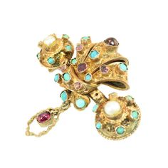 This is part of Chairish’s Fine Jewelry assortment.  1840s Georgian 10K gold brooch with semi-precious stones. Deeply three-dimensional baroque design w/ crimped-bezel-set amethysts, turquoises, garnets, and pearls; an etched dangle is centered w/ a collet-set cabochon garnet. An unusual design element: double pin-backs to keep the brooch from tilting when worn; and attached w/ a fine chain is the original safety stick-pin topped w/ a seed pearl. All stones original, condition is impeccable thro Baroque Design, Gold Brooch, Gold Brooches, Pearl Brooch, Unusual Design, Seed Pearl, Semi Precious Stones, Pin Backs, Matte Gold